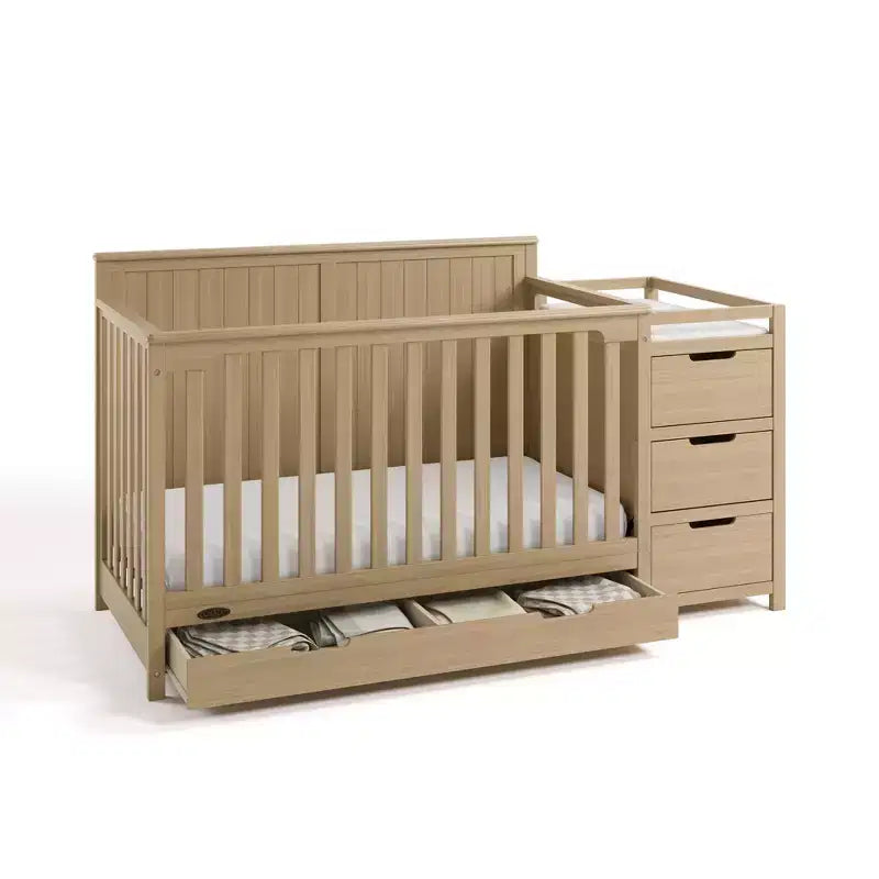 Lettino trasformabile 5 in 1 con fasciatoio e cassetto